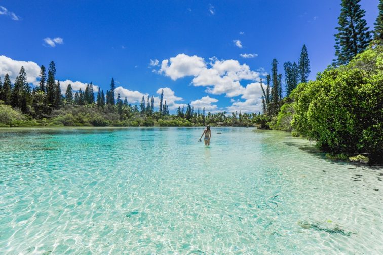 A girl standing in the lake New Caledonia