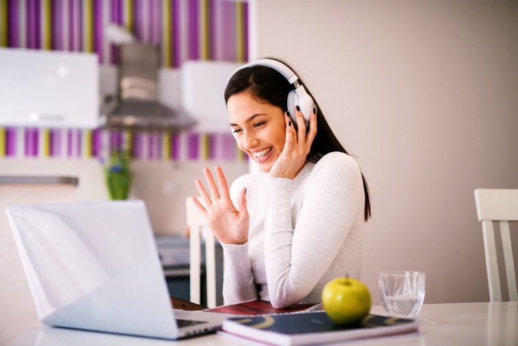 she is studying with online while having her headset on.