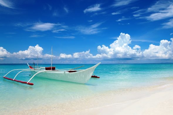 White boat on tropical Bantayan island in Philippines